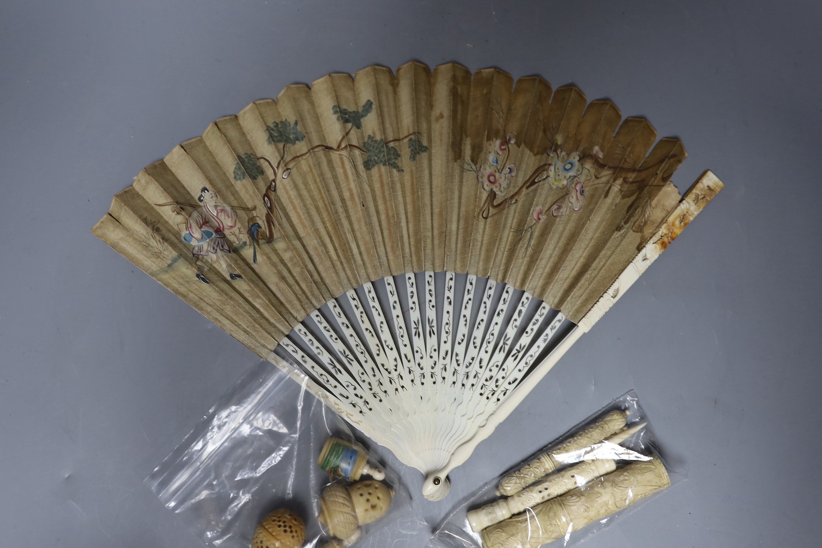 A mix collection of antique ivory to include needle cases, silver mounted gloves stretcher, etc and nut sewing accessories